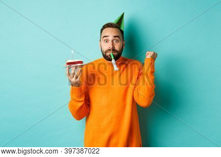 Happy Birthday Guy Celebrating, Wearing Party Hat, Blowing Wistle And Holding Bday Cake And Doing Fi