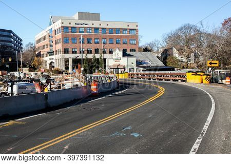 DARIEN,CT, USA-NOVEMBER 29 2020: Construction on bridge on Darien -Stamford border line with Chilton Trust building and The Board Yard BBQ and Grill