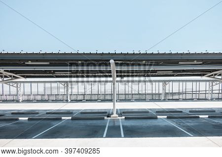 Car Parking Lot Area On Deck Floor Of Shopping Mall, Perspective View Empty Of Car Park Structure Bu