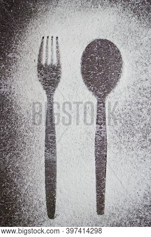 Too Much Sugar Is Harmful. Outline Of A Fork And Spoon In Sprinkled White Powdered Sugar.