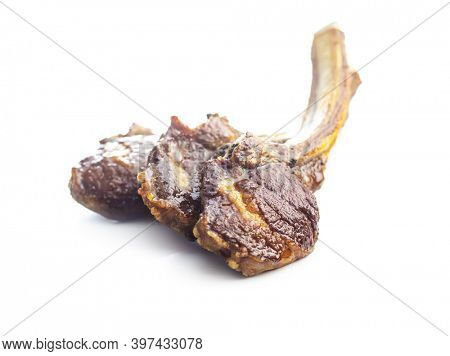 Grilled lamb chops isolated on white background.