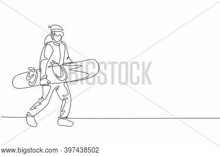 Single Continuous Line Drawing Of Young Sportive Snowboarder Man Walk And Hold Snowboard At Mountain
