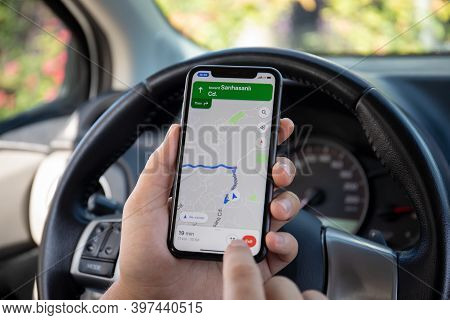 Alanya, Turkey - October 5, 2020: Man Hand Holding Apple Iphone 11 With Google Navigation Maps On Th