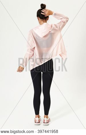 Woman in a baby pink sports jacket mockup