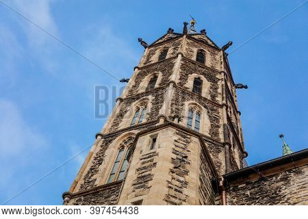 Low Angle View At A Part Of Medieval Stone St. Bartholomew´s Church In Autumn Day, Arched Windows, C