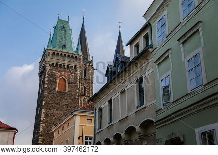 Medieval Stone St. Bartholomew´s Church With Belfry Tower, Gothic Cathedral At The End Of Narrow Str