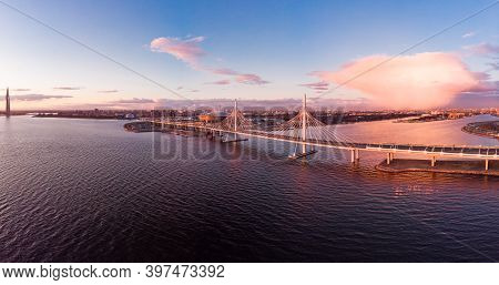 Aerial Panoramic View To Evening St. Petersburg And Cable-stayed Bridge Across Petrovsky Fairway. We