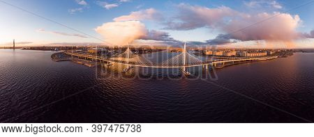 Aerial Panoramic View To Evening St. Petersburg And Cable-stayed Bridge Across Petrovsky Fairway. We