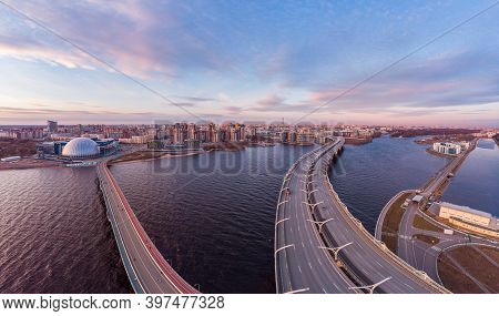 Aerial Panoramic View To Evening St. Petersburg And Cable-stayed Bridge Across Petrovsky Fairway. We