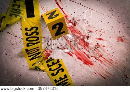 Yellow Tape, Crime Scene Marker And Smithereens In Blood On Marble Table, Above View