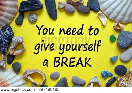 Time To Break. Text 'you Need To Give Yourself A Break' On A Beautiful Yellow Background. Sea Stones