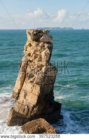 Peniche Sea Cliffs With Berlengas Island On The Background With Atlantic Ocean, In Portugal