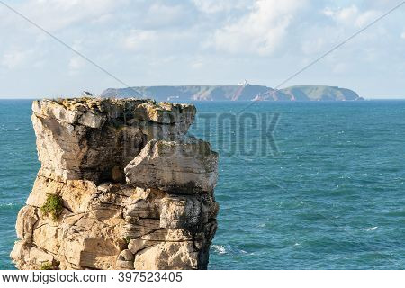 Peniche Sea Cliffs With Berlengas Island On The Background With Atlantic Ocean, In Portugal