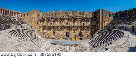 Aspendos Ancient City. Panoramic View Of The Ancient Theater. Antalya, Turkey. Popular Tourist Area.