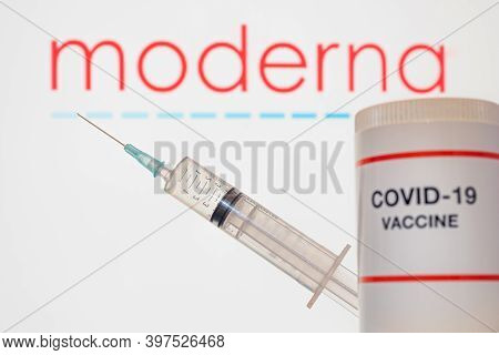 Vaccine From Moderna Company Against Covid-19 And A Syringe On White Background, Denmark, December 1