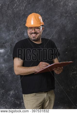 Middle-aged Man In A Helmet Construction Superintendent