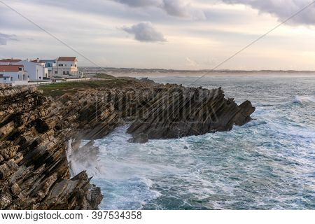 Baleal Island Houses With Sea Cliffs With Crashing Waves In The Atlantic Ocean In Peniche, Portugal