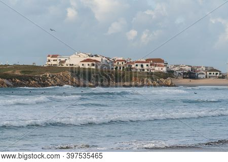Baleal Island Beach And Beautiful Houses With Surfers On The Atlantic Ocean In Peniche, Portugal