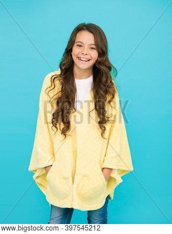 Little Girl With Long Hair. Happy Childhood. Feeling Comfy. Adorable Child On Turquoise Background. 