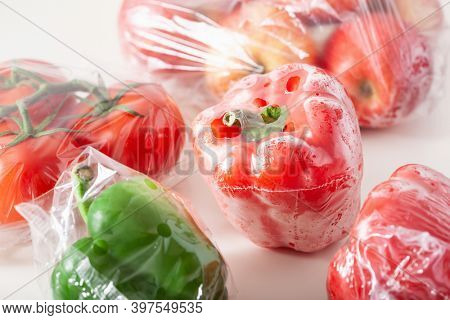 single use plastic packaging issue. peppers tomatoes apples vegetables in plastic bags
