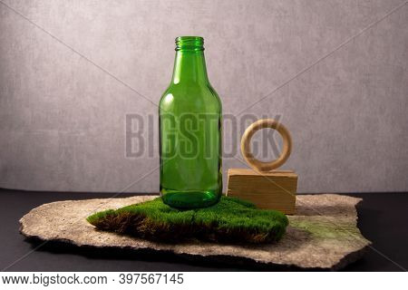 Recycling Concept. The Idea Of Preserving The Environment And Recycling Glass. Concept Of Natural Ma