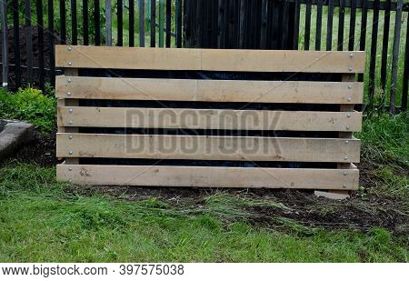 A Composter Made Of Natural Beech Prisms Built Horizontally With Black Foil Inside In A Meadow Near 