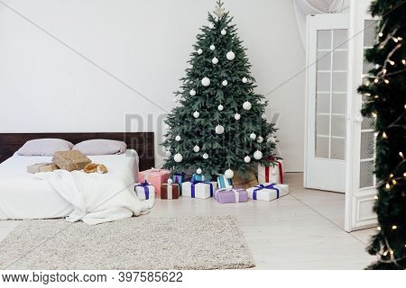 Bedroom With Bed Decor New Year And Beautiful Christmas Tree With Gifts
