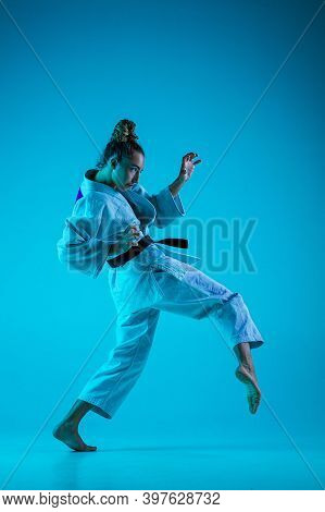 Active Training. Professional Female Judoist In White Judo Kimono Practicing And Training Isolated O