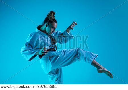 Active Training. Professional Female Judoist In White Judo Kimono Practicing And Training Isolated O