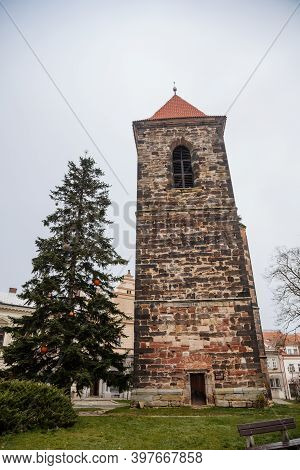 Gothic Medieval Stone Bell Tower Near Baroque Saint Gothard Church In Old Historic Center Of Cesky B