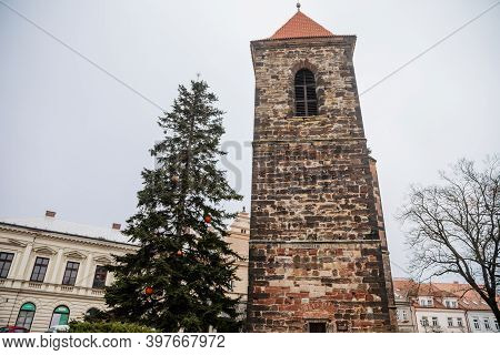 Gothic Medieval Stone Bell Tower Near Baroque Saint Gothard Church In Old Historic Center Of Cesky B