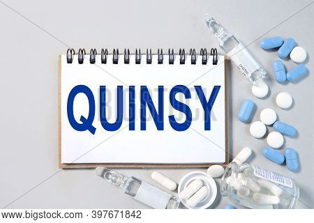 Quinsy, Text On White Paper Over Gray Background. Medical Concept