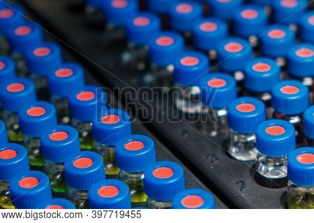 Hplc Glass Vials In The Rack. Research And Development Of Pharmaceuticals And Vaccines. High Perform