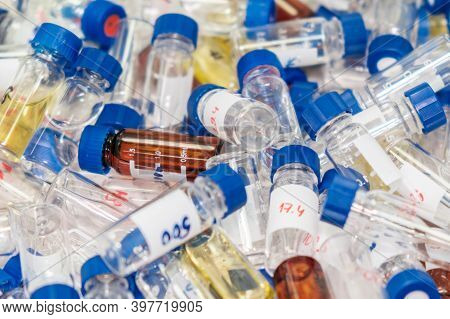 Dirty Used Chromatographic Vials With Blue Caps. Hplc Analysis At Analytical Chemistry Laboratory. D