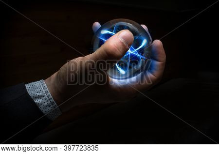 Holding Atom In Fortune Teller Magic Crystal Ball