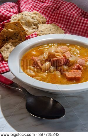 Simple Slow-cooker Ham And Cannellini Bean Soup With Multigrain Hexagon Crackers For Dipping