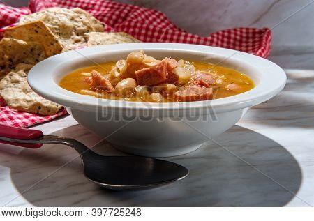 Simple Slow-cooker Ham And Cannellini Bean Soup With Multigrain Hexagon Crackers For Dipping