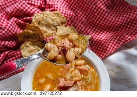Simple Slow-cooker Ham And Cannellini Bean Soup With Multigrain Hexagon Crackers For Dipping