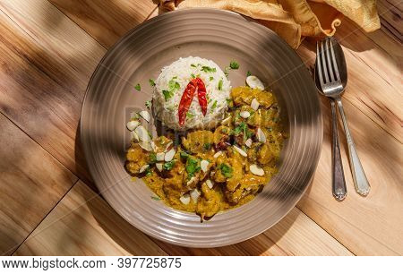 Indian Chicken Korma Curry Dinner With Basmati Rice And Almonds