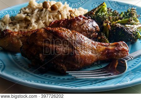 Authentic Spicy Jamaican Jerk Chicken Legs Served With Coconut Rice And Pigeon Peas