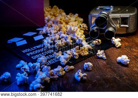 Movie Theater Popcorn With Butter And Blue Backlighting