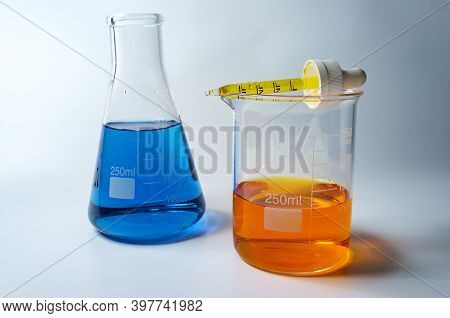 Close Up Glass Measuring Beaker For Science Experiment Background