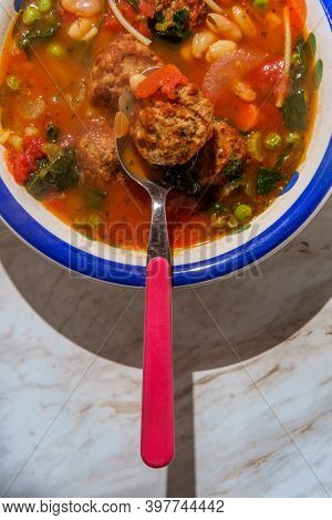 Loaded Italian Tomato Meatball Soup With Cannellini Beans Spinach Green Peas And Parmesean Rind