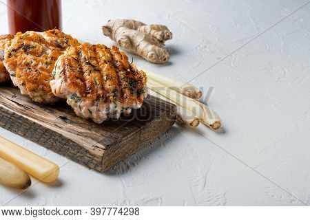 Cooked Fish Patties With Salmon And Lemongrass, On White Textured Background