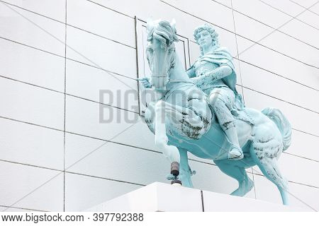 Beppu, Kyushu, Japan, June 21, 2017: Sculpture Of A Rider Sitting On A Horse On The Facade Of The Bu