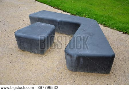 Gray Monolithic Concrete Park Bench Made Of Concrete In The Shape Of Round Stones Anthracite Color P