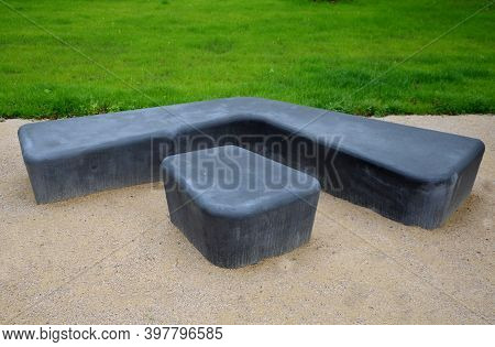 Gray Monolithic Concrete Park Bench Made Of Concrete In The Shape Of Round Stones Anthracite Color P