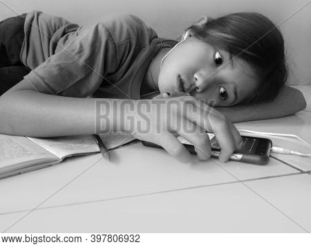 Cianjur, West Java, Indonesia, December 3, 2020, Portrait of a Sleepy Girl