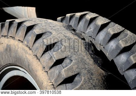 Very Used Off-road Truck Tires With Two Wheels On Each Axle. Missing A Sample That Is Badly Worn, Th