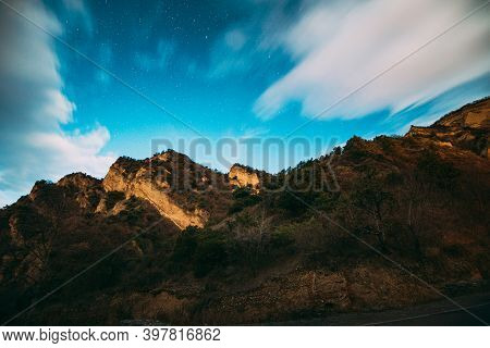Mtskheta, Georgia. Autumn Night Starry Sky With Glowing Stars Above Limestone Canyon Near Monastic S